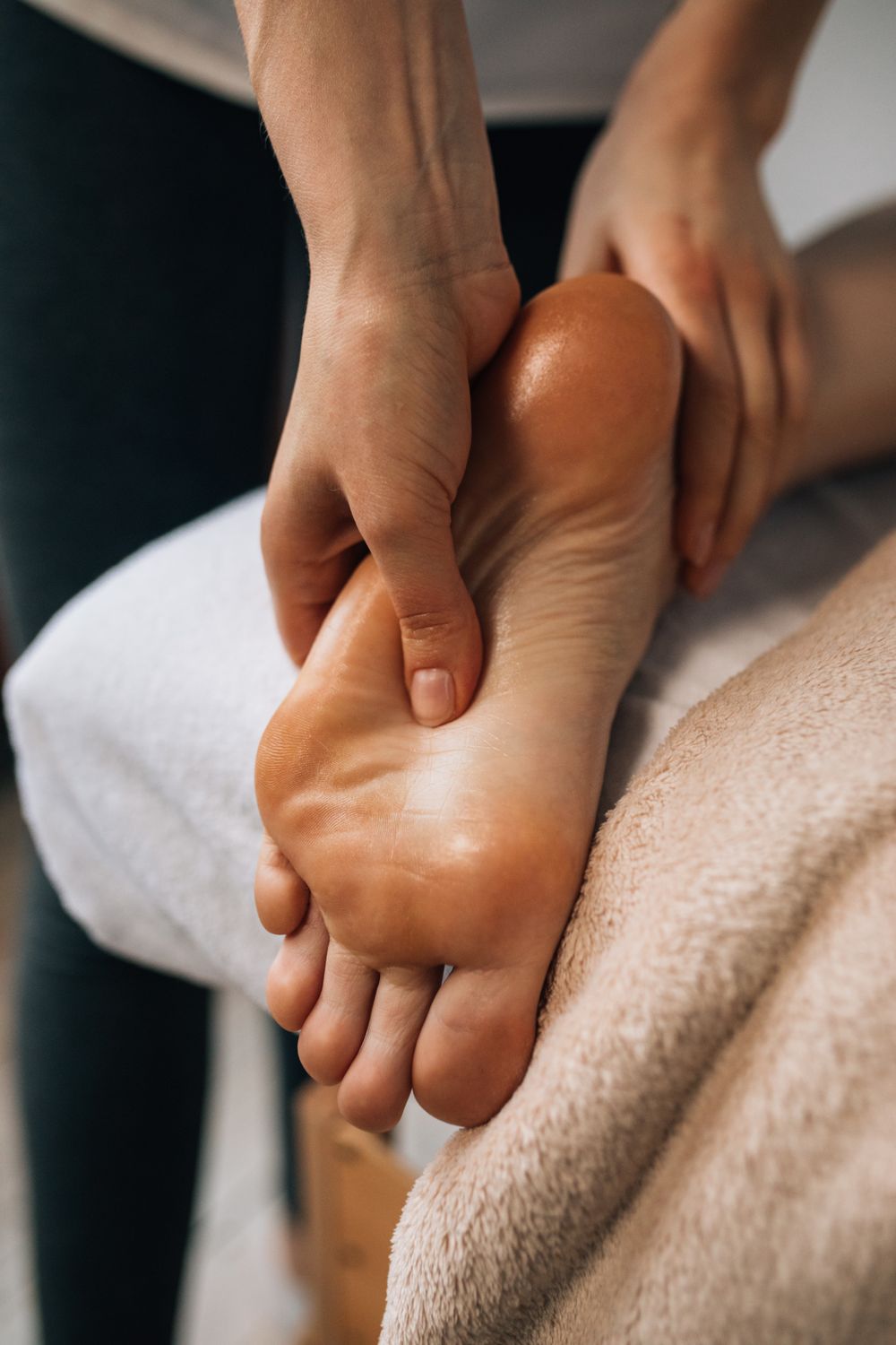 Thumb pressure applied to the sole during foot reflexology